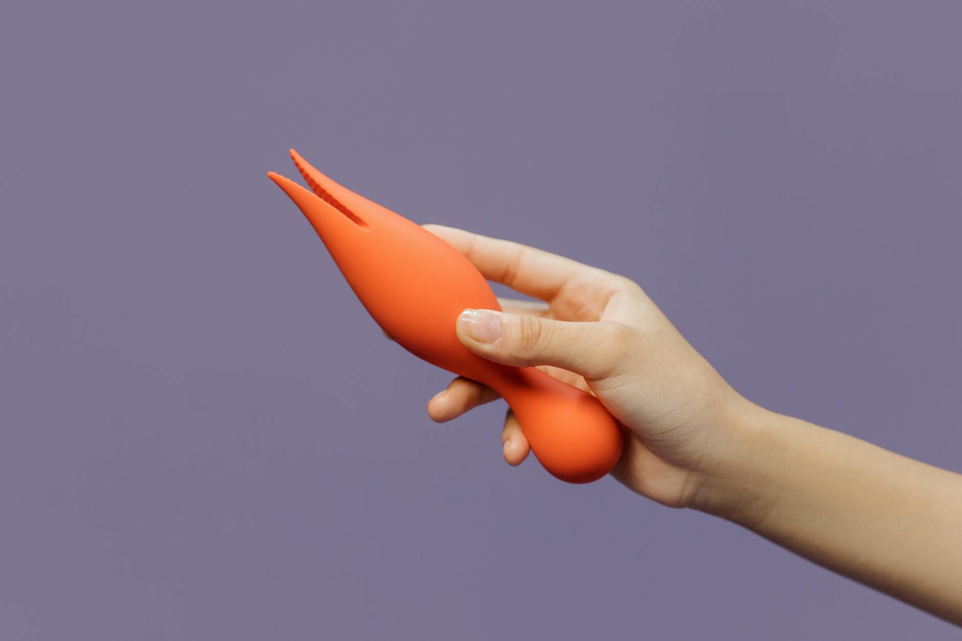 Three colorful vibrators arranged on white fabric, symbolizing choice and openness in couples exploration